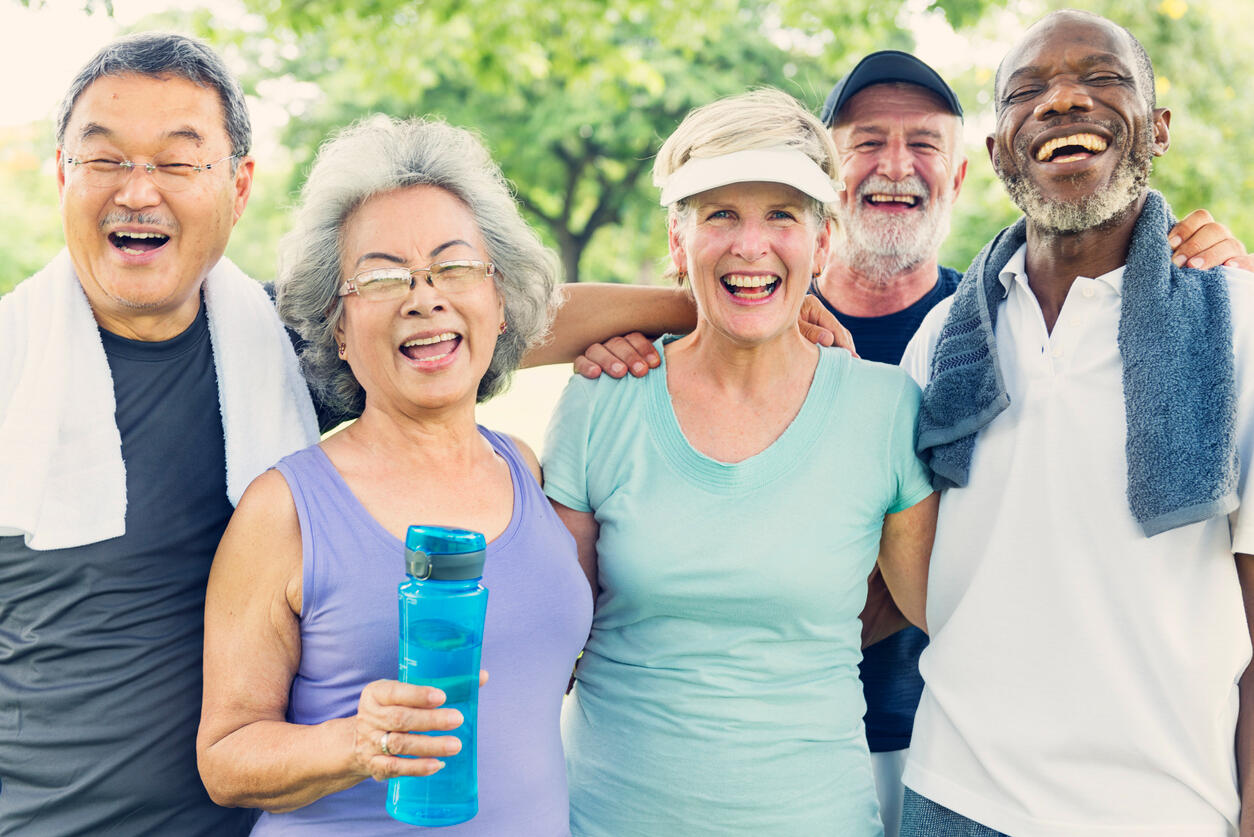 A group of senior friends relax after exercise